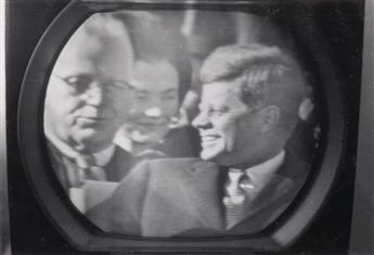 (KENNEDY, JOHN F.) Mini-album with 14 snapshots made of a television screen depicting Kennedys presidential inauguration.